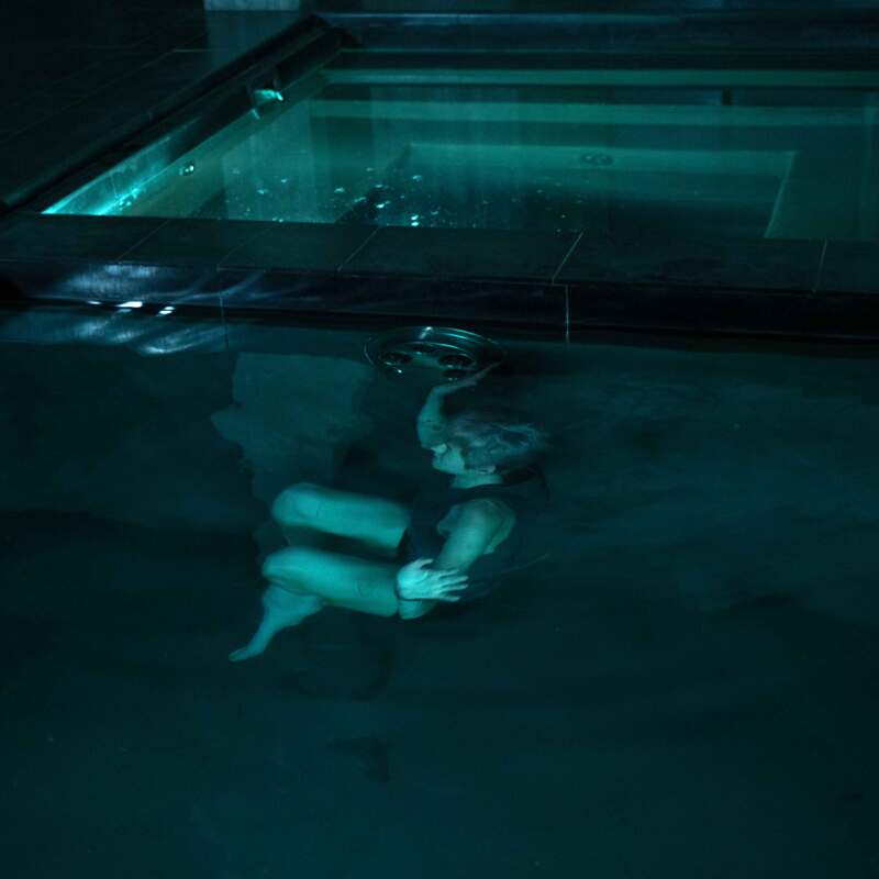 Darby underwater in a pool.