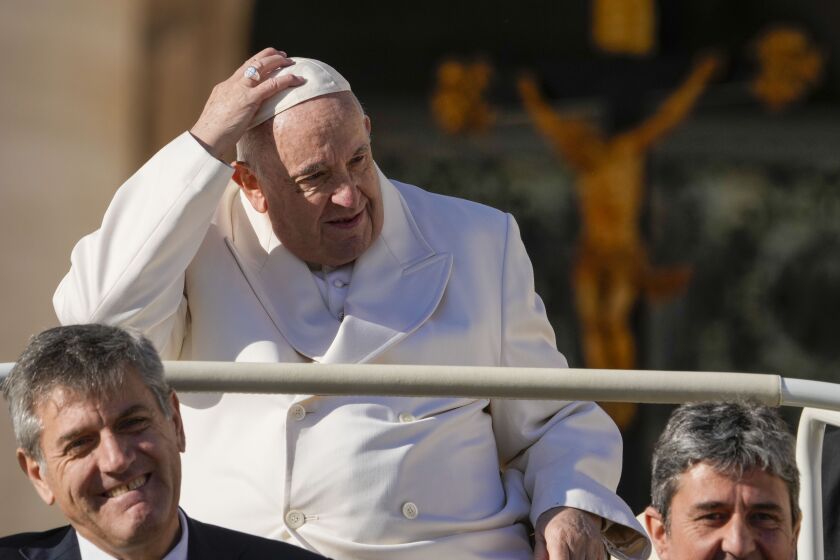 Pope Francis leaves at the end of his weekly general audience in St. Peter's Square at The Vatican, Wednesday, Nov. 30, 2022. (AP Photo/Andrew Medichini)