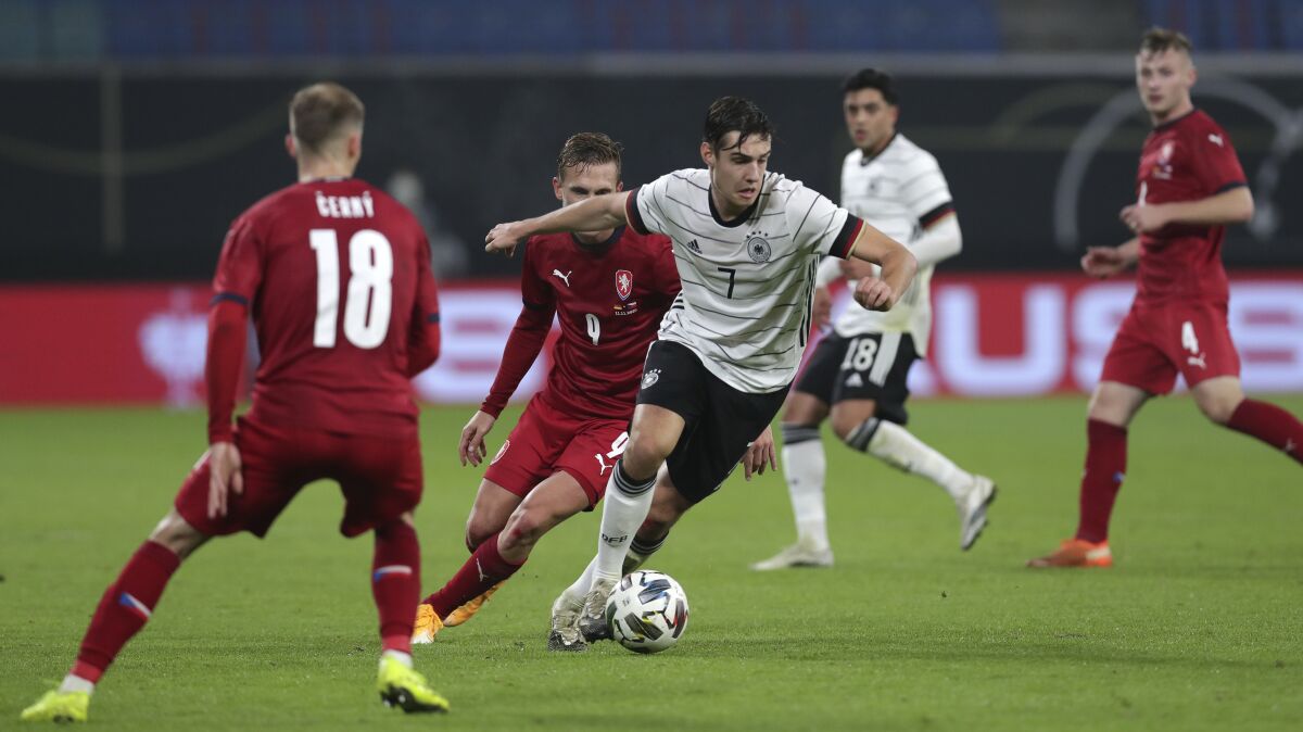 Germany's Florian Neuhaus controls the ball during the friendly soccer match between Germany and Czech Republic in Leipzig, Germany, Wednesday, Nov. 11, 2020. (AP Photo/Michael Sohn)