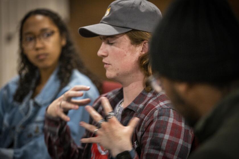 La Mirada, CA - March 20: Mahlia St. Cyr, left, Brandon Hall, center, and Jaloni Wilson participate in a discussion with the St. Thomas Collective at the United Methodist Church of La Mirada Sunday, March 20, 2022. A group of students and former students who attend Biola University in La Mirada are meeting off campus to talk about the questions they have about their faith. Their group is called the St. Thomas Collective. (Allen J. Schaben / Los Angeles Times)