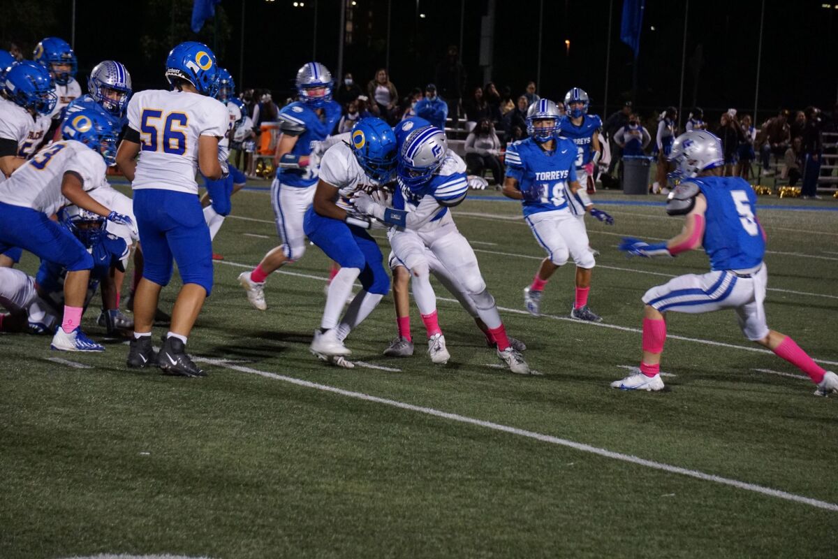 La Jolla Country Day School (in blue) battles O'Farrell Charter School on Oct. 8 in an eventual 63-6 Country Day victory.