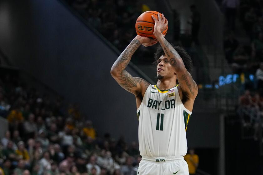 Baylor's Jalen Bridges shoots a basket against Texas during the first half of an NCAA college basketball game, Monday, March 4, 2024, in Waco, Texas. (AP Photo/Julio Cortez)