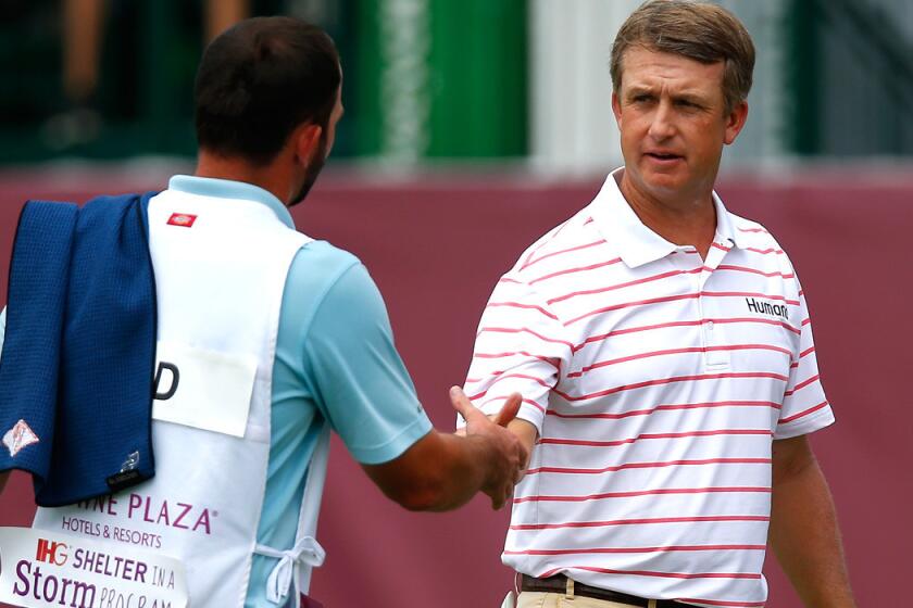 David Toms shakes hands with the caddie for playing partner Brendon Todd after finishing the third round on Saturday at Colonial.
