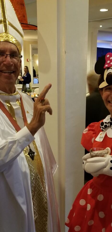 Ted Walker, as the Pope, blesses Cecilia Carrick as Minnie Mouse.