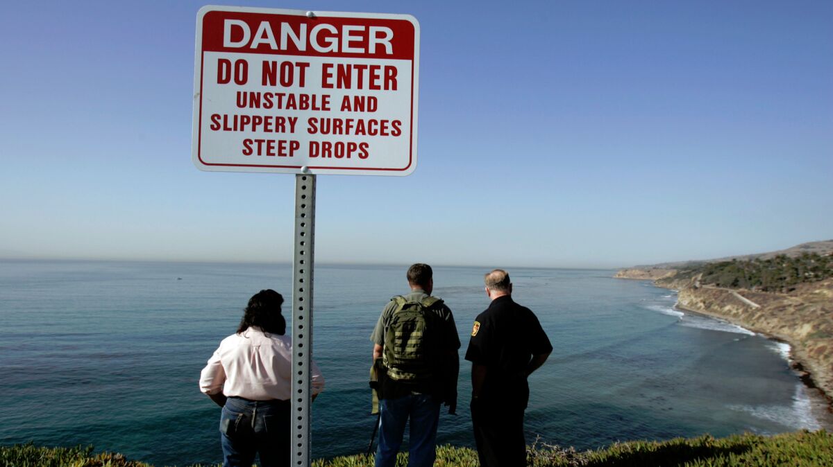 The bodies were found about 10 a.m. on a sandy beach at the foot of a cliff near the 700 block of West Paseo Del Mar.