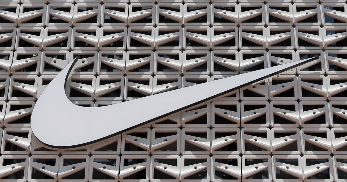 The Nike logo hangs at a store in Miami Beach, Fla., in 2017.