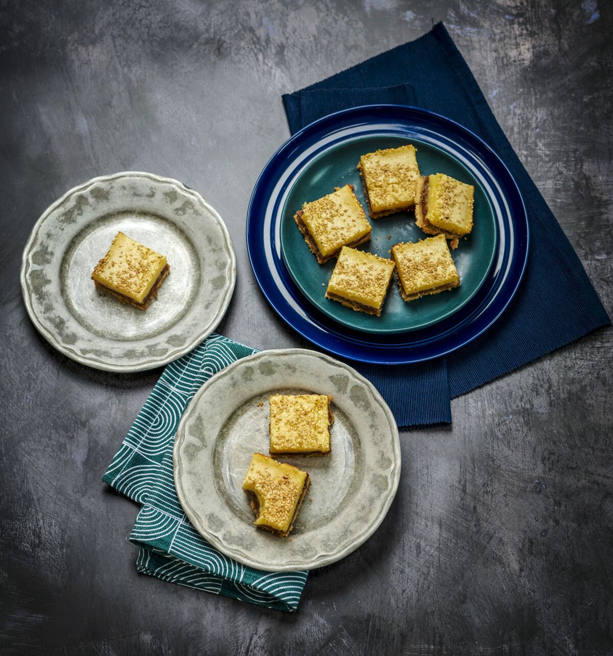 Lemon Bars With Date and Sesame are plated up and ready to eat.