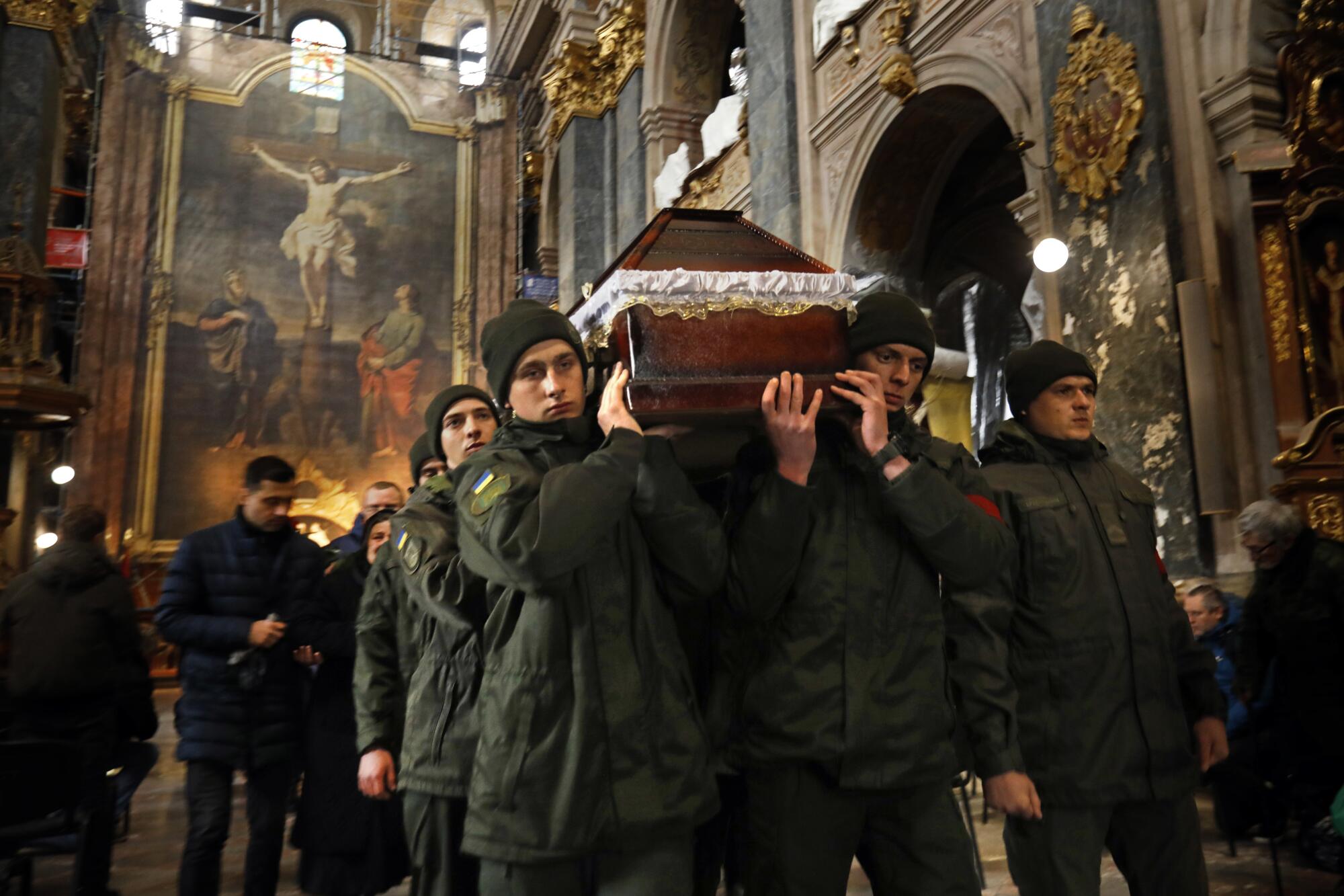 A funeral was held for Denis Metyolkin, a postal carrier killed in action on the eastern front.