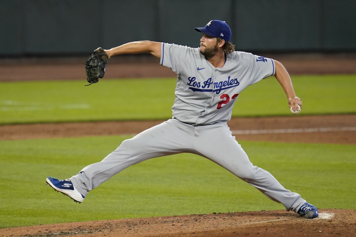 Dodgers pitcher Clayton Kershaw throws during the seventh inning against the Seattle Mariners.