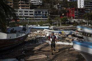 A fisherman arrives to a yacht club to join a rescue team in Acapulco, Mexico, Saturday, Oct. 28, 2023, in the aftermath of Hurricane Otis. (AP Photo/Felix Marquez)