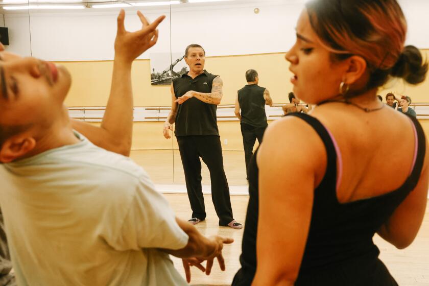 Los Angeles, CA - September 28: Viktor Manoel teaches a punking dance class to students at MKM Cultural Arts Center on Wednesday, Sept. 28, 2022 in Los Angeles, CA. Punking, later referred to as whacking, is a street dance from the gay community of Los Angeles developed in the 1970s. (Dania Maxwell / Los Angeles Times)