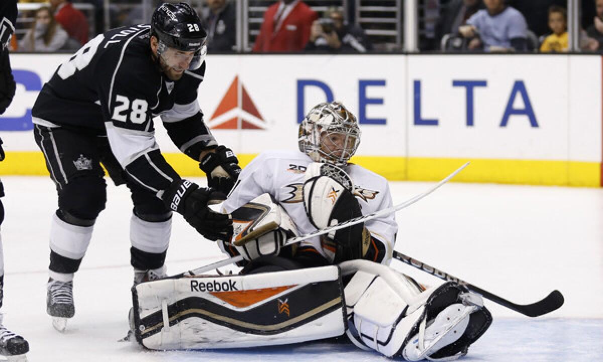 Ducks goalie Frederik Andersen, right, makes a save in front of Kings center Jarret Stoll during the Kings' 2-1 loss Saturday. Kings Coach Darryl Sutter isn't pleased with the production from some of his lines.