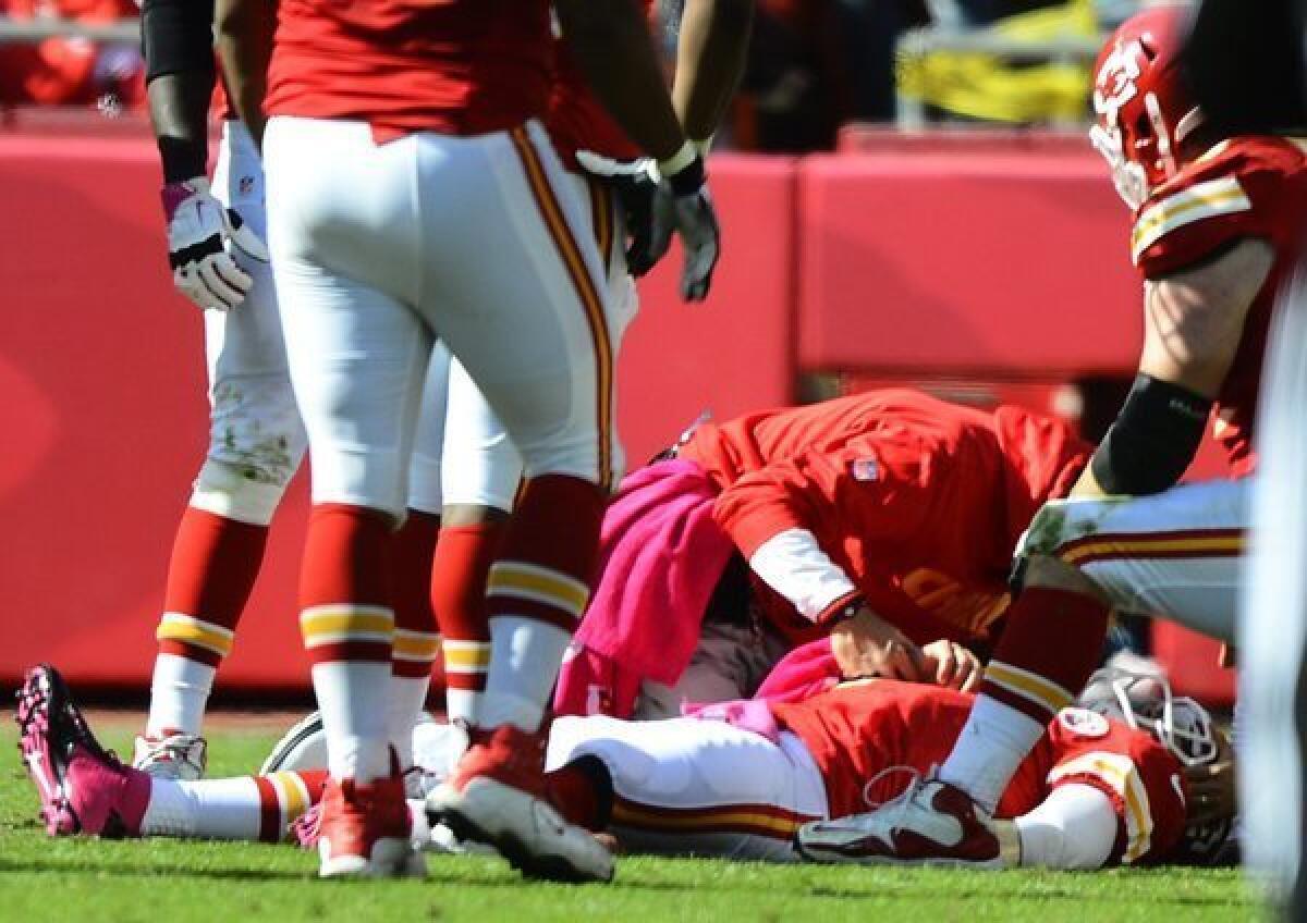 Kansas City Chiefs quarterback Matt Cassel lies on the ground after getting injured Sunday.