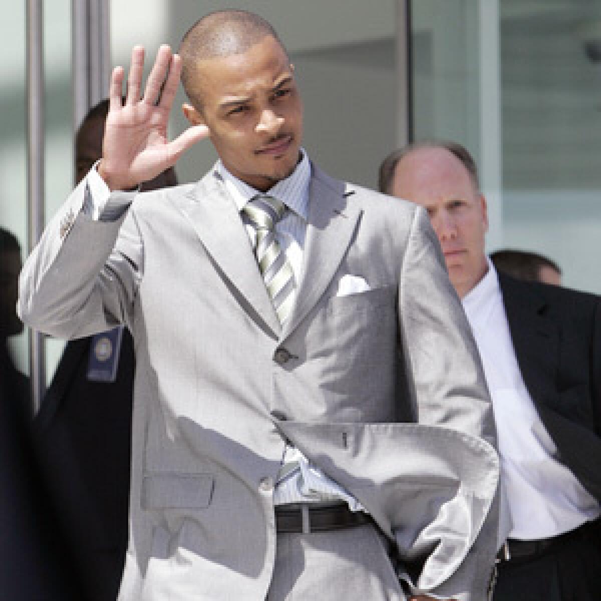 Rapper T.I., whose real name is Clifford Harris, leaves the Richard B. Russell Federal Courthouse in Atlanta, Thursday, March 27.