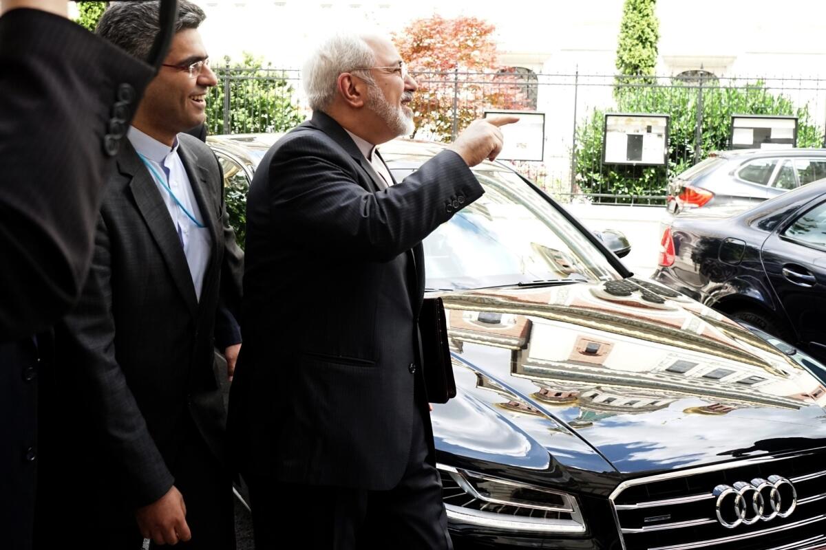 Iranian Foreign Minister Javad Mohammad Zarif, center, arrives at the Iranian Embassy in Vienna on Monday to meet with the vice president of the European Commission, Catherine Margaret Ashton, during talks on Tehran's nuclear program.
