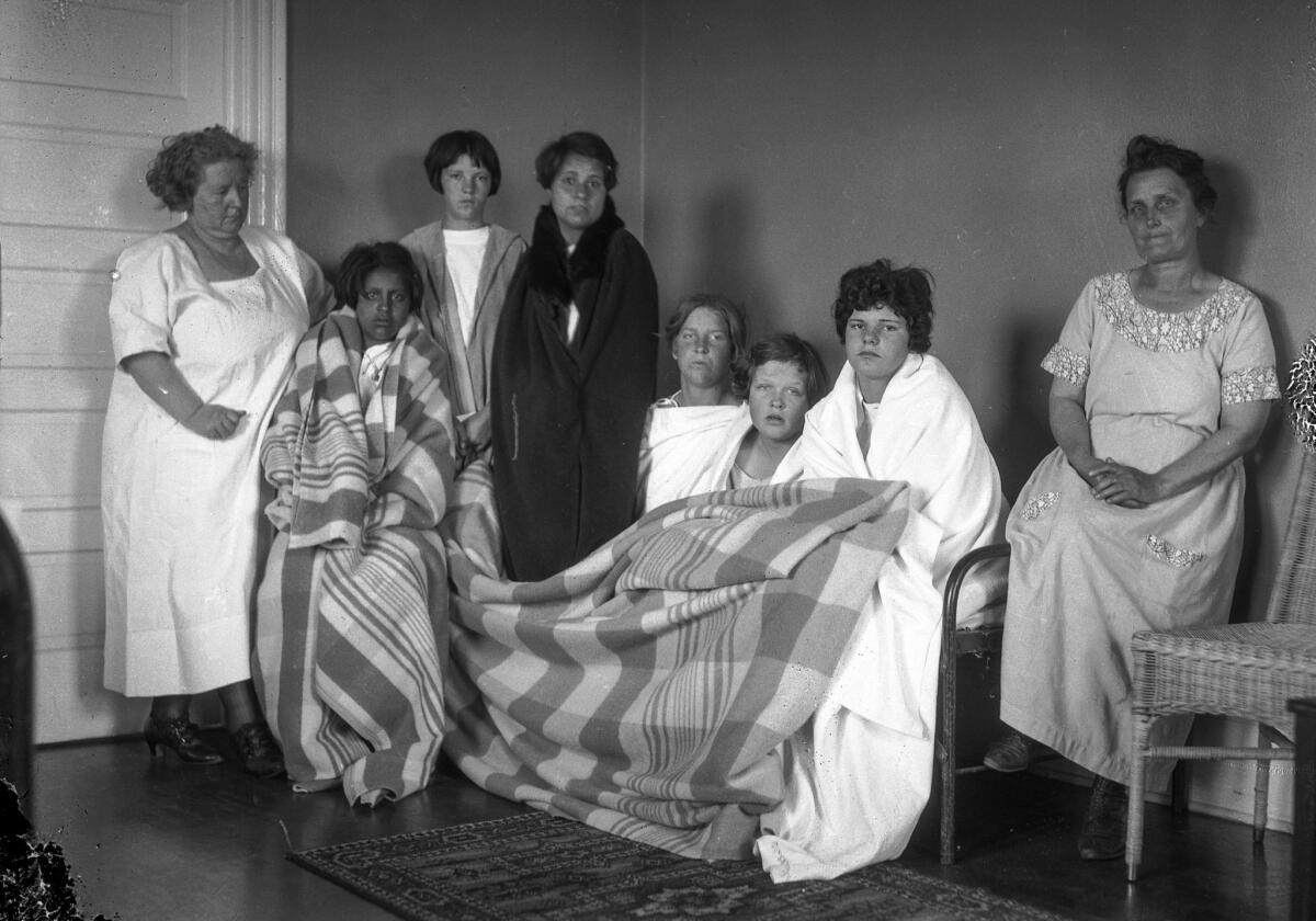 June 1, 1924: St. Catherine’s Hospital superintendent Mrs. Anna Taugher, from left, with Hope Development School residents Sebastinia Rodriguez, Alberta Hughes, Lorraine Gould, Lois Blick, Dorothy Smith and Elsie Vidal and Mrs. Anna Rodemaker, assistant matron. after the fire.