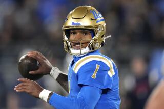 UCLA quarterback Dorian Thompson-Robinson passes during the first half of an NCAA college football game against Arizona 