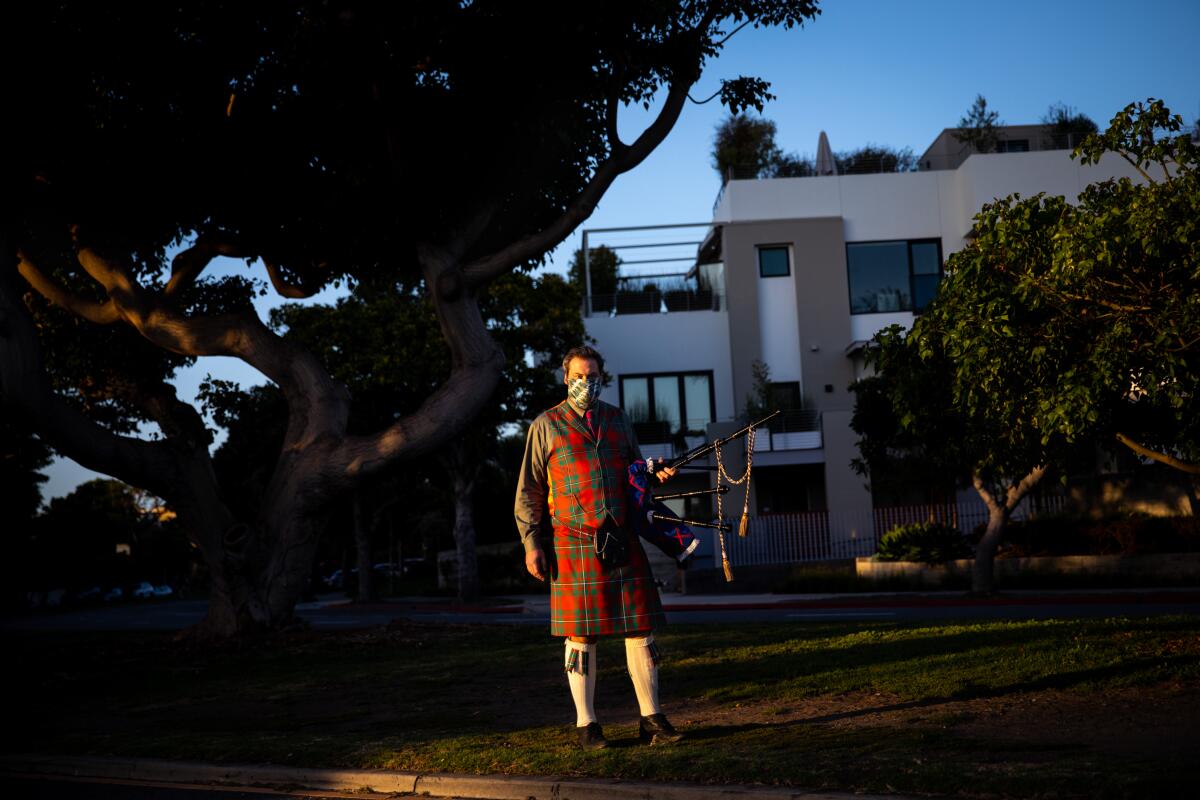 Andrew McGregor, at the corner of San Vicente Boulevard and Ocean Avenue, makes his way to Palisades Park on Friday.