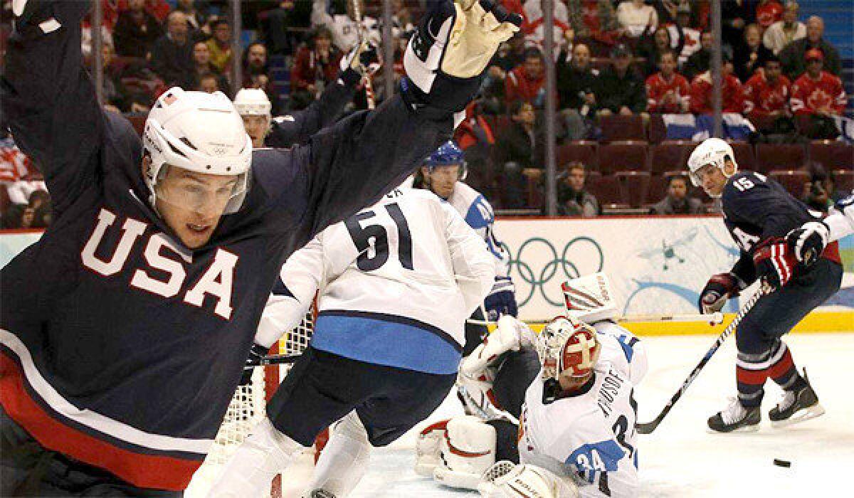 Zach Parise celebrates after scoring a goal against Finland at an ice hockey semifinal game during the 2010 Vancouver Olympics on Feb. 26, 2010.