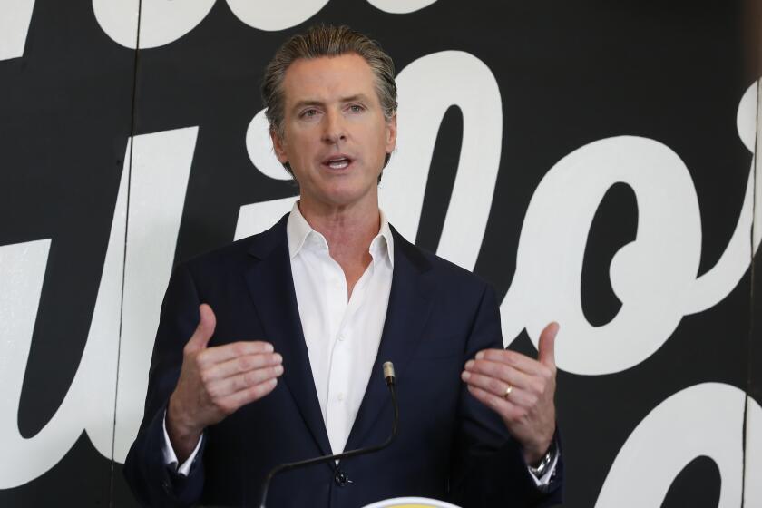 Gov. Gavin Newsom discusses his plan for the gradual reopening of California businesses during a news conference at the Display California store in Sacramento, Calif., Tuesday, May 5, 2020. Newsom warned counties that going too far in loosening coronavirus restrictions, could endanger public health. Display California, which sells locally-made items from around the state, is planning to open for curbside service on Friday under upcoming state guidelines. (AP Photo/Rich Pedroncelli, Pool)