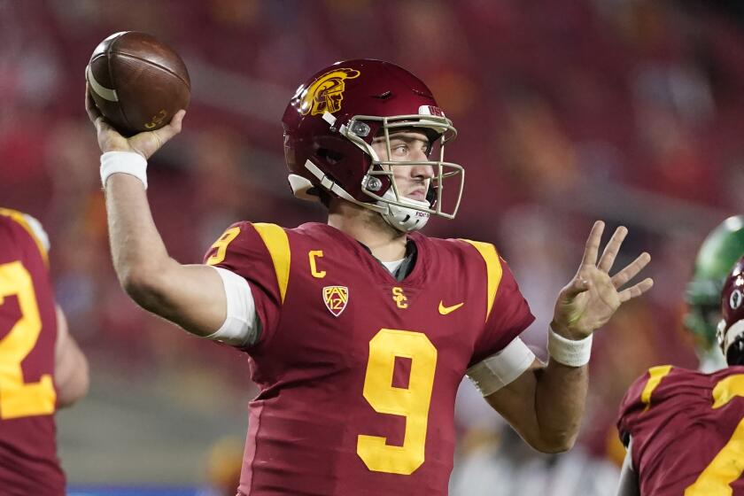 Southern California quarterback Kedon Slovis (9) throws a pass during the first half of an NCAA college football game for the Pac-12 Conference championship against Oregon Friday, Dec 18, 2020, in Los Angeles. (AP Photo/Ashley Landis)