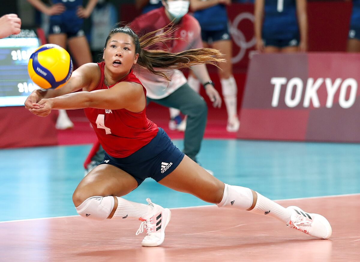 U.S. libero Justine Wong Orantes lunges for the ball during a semifinal against Serbia