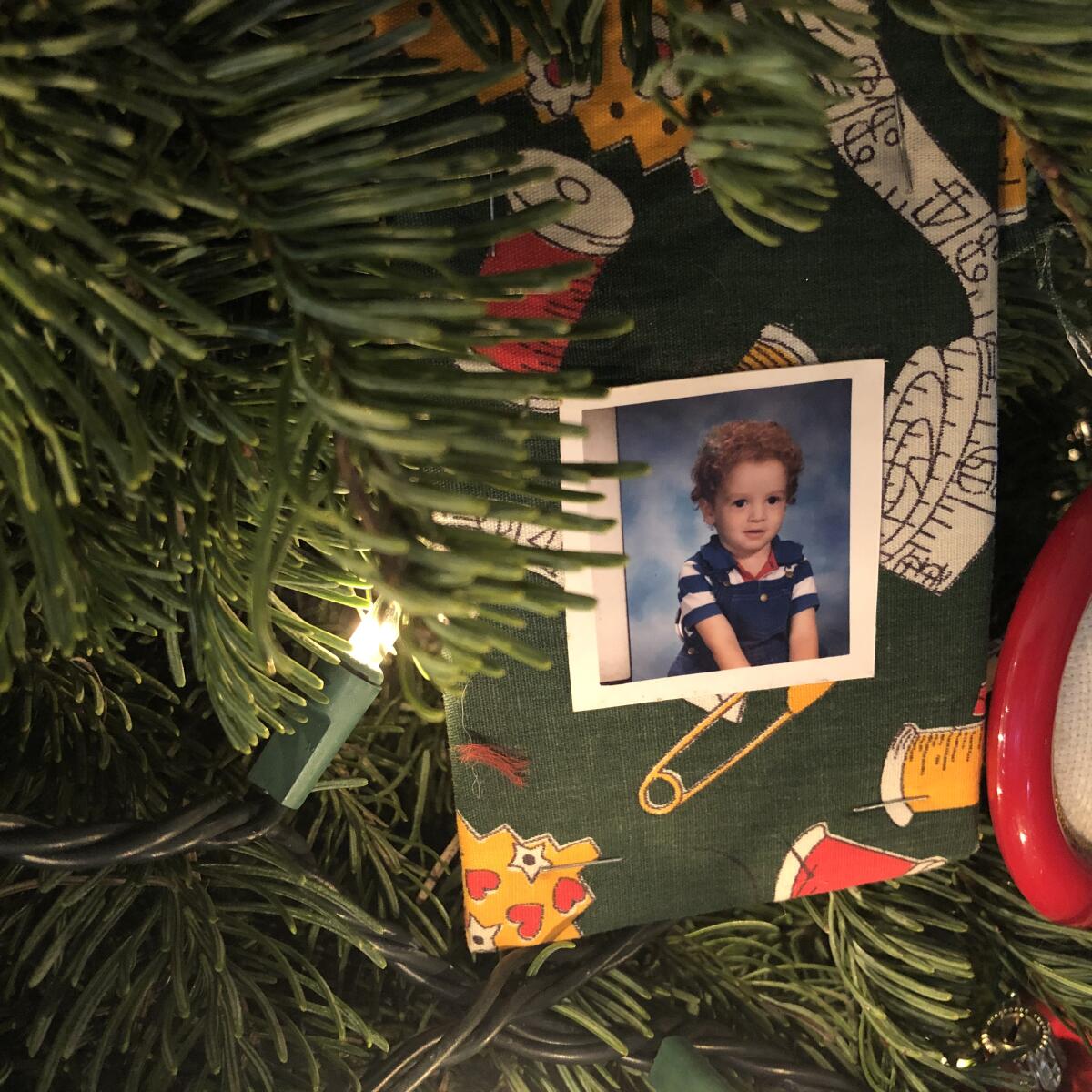 A tree full of ornaments by the kids