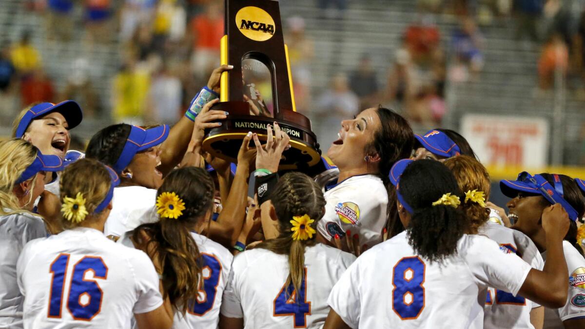 Florida players celebrate after defeating Michigan, 4-1, in the final game in the NCAA softball Women's College World Series on Wednesday in Oklahoma City.