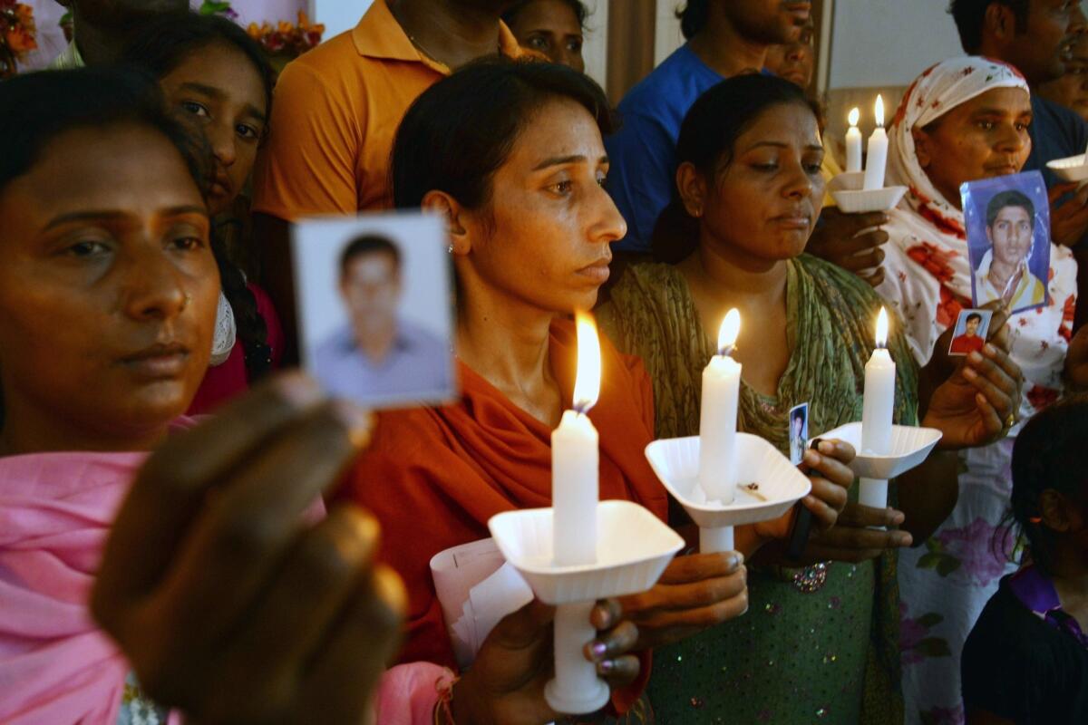 Relatives of Indian workers held in Iraq gather at a church in Amritsar on June 26.