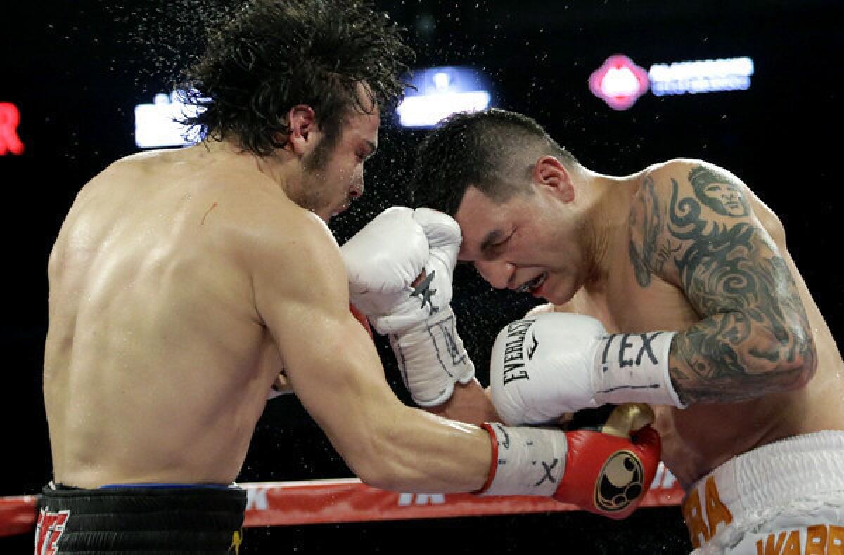 Julio Cesar Chavez Jr., left, and Bryan Vera exchange punches during their super-middleweight bout on Saturday in San Antonio.