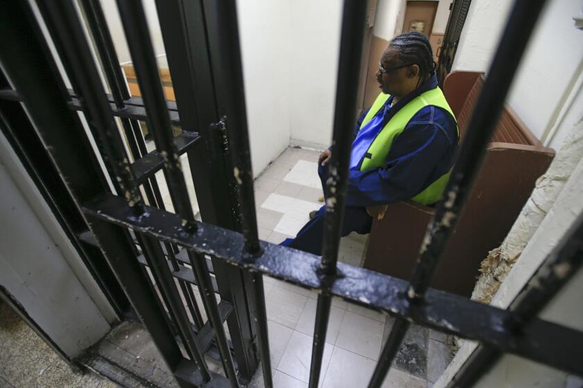 A prisoner waits inside a holding cell to attend a parole board hearing at San Quentin State Prison. Gov. Jerry Brown's ballot Proposition 57 would offer new chances at parole for some inmates, and additional good behavior credits for others.