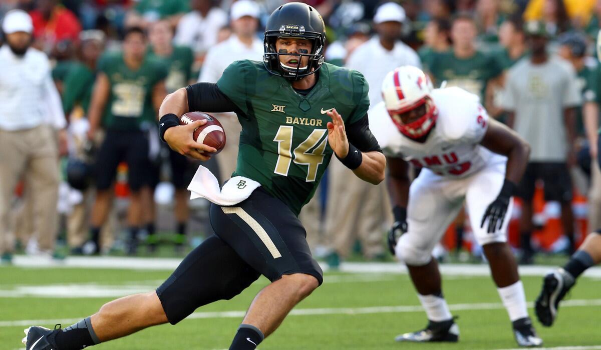 Baylor quarterback Bryce Petty breaks into the Southern Methodist secondary on a run in the first half Sunday at McLane Stadium in Waco, Texas.