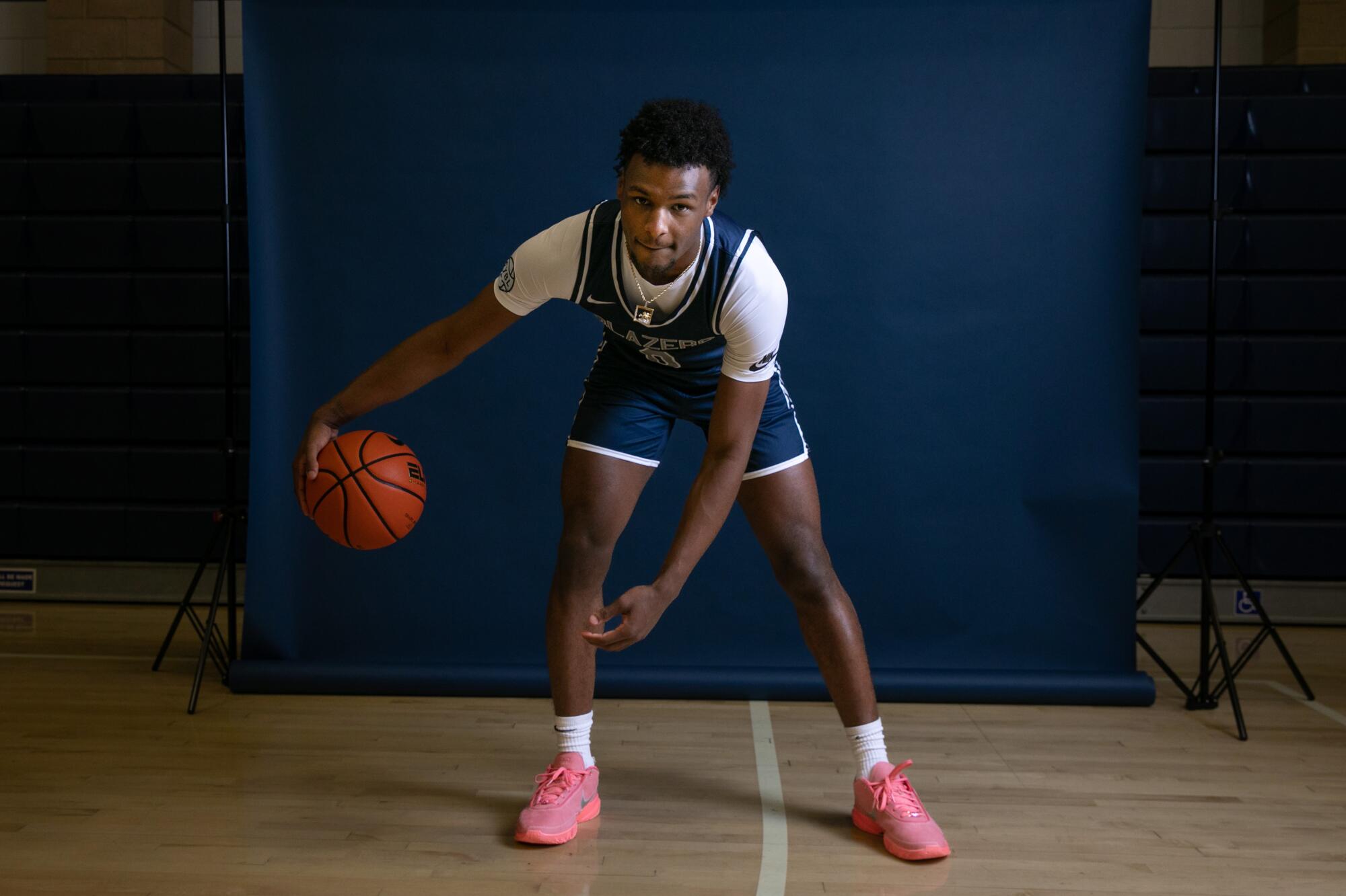 Bronny James dribbles a basketball during a photo shoot at Sierra Canyon High's media day on Oct. 12, 2022.