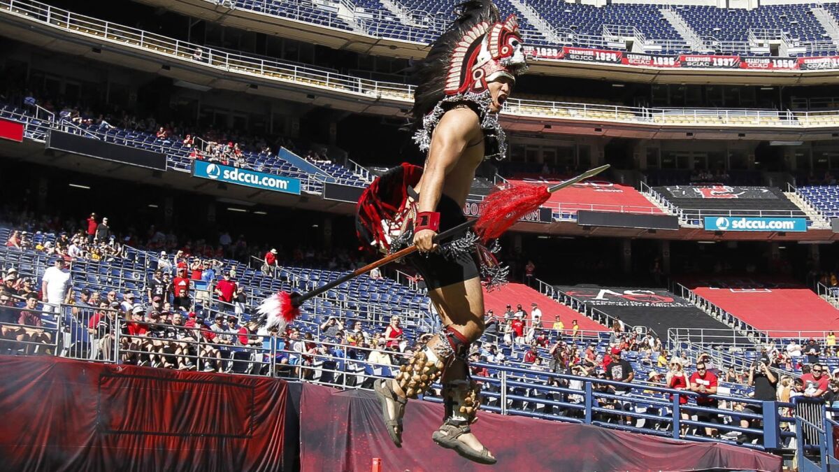 The Aztecs Warrior mascot runs onto the field before the Aztecs play New Mexico at SDCCU Stadium in November 2017.
