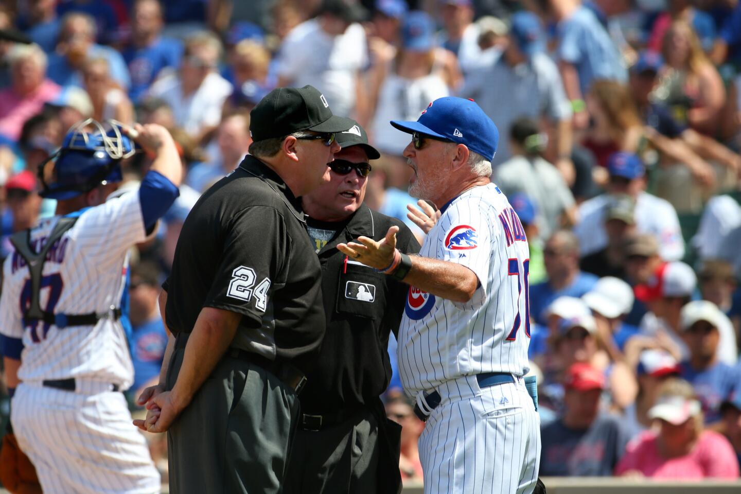 Joe Maddon argues with the umpires in the fifth inning about a pitch by Jake Arrieta they claimed hit the batter, Charlie Blackmon, during a game against the Rockies at Wrigley Field in Chicago on Sunday, June 11, 2017.