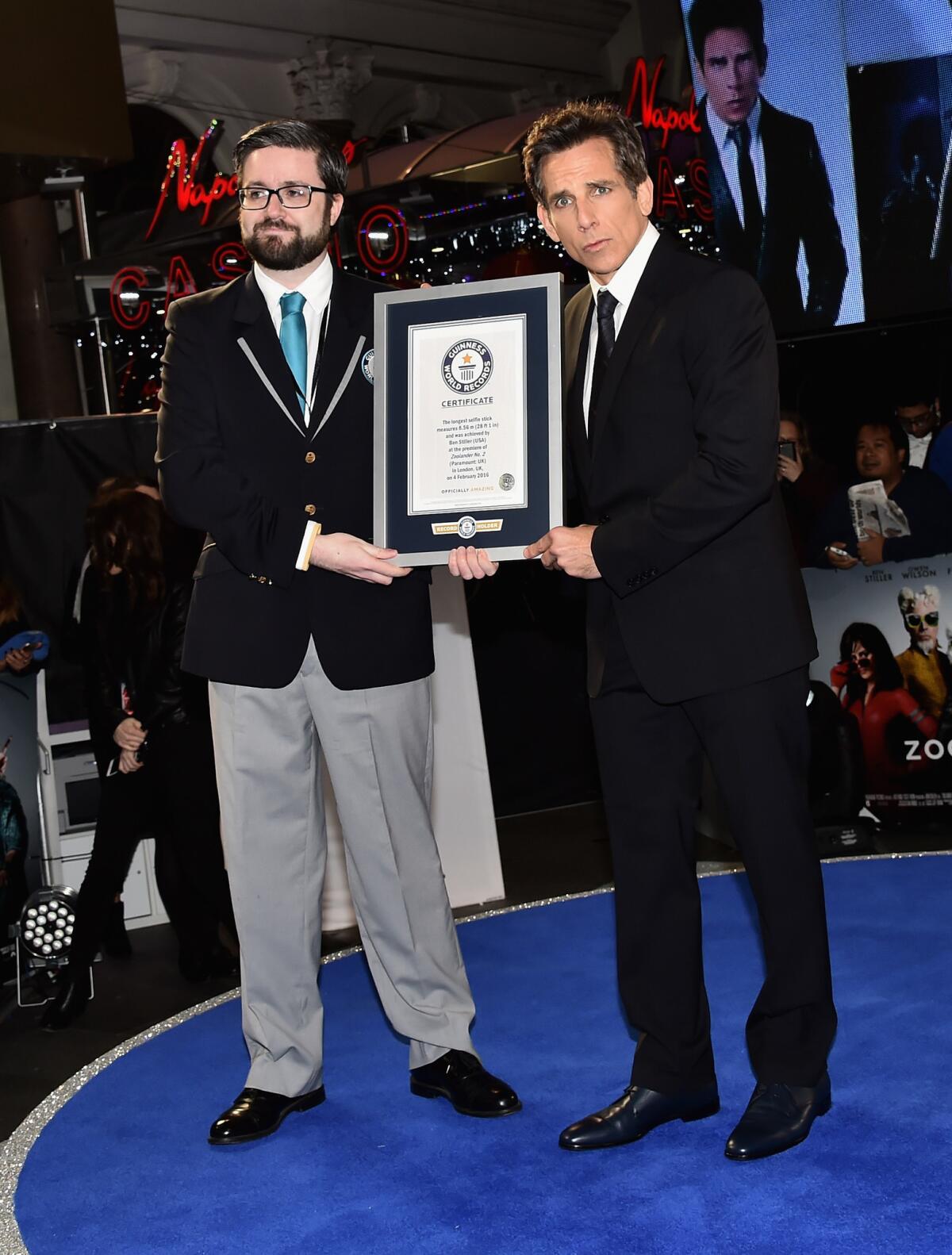 Ben Stiller, right, with the certificate for the record-breaking selfie stick.