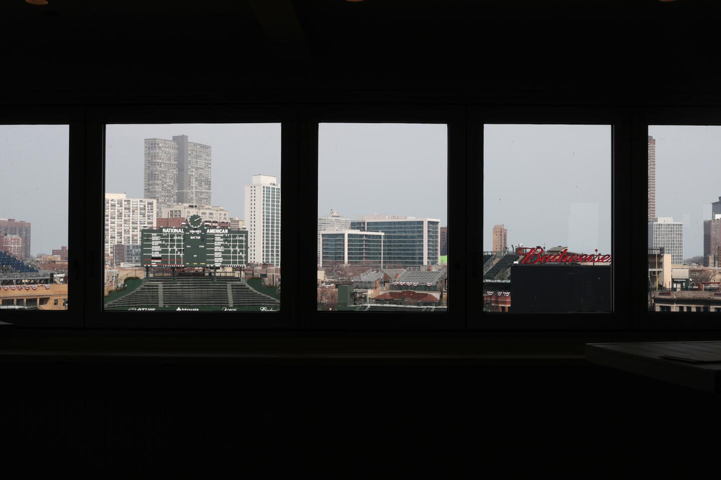 Windows frame the view past the outfield at the new Catalina Club in the upper deck behind home plate at Wrigley Field on April 6, 2019.