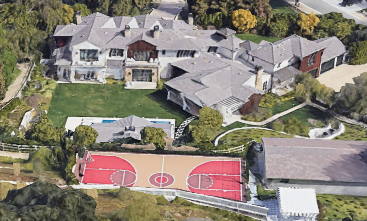 The three-acre compound includes a 12,500-square-foot home, guesthouse, barn and basketball court.