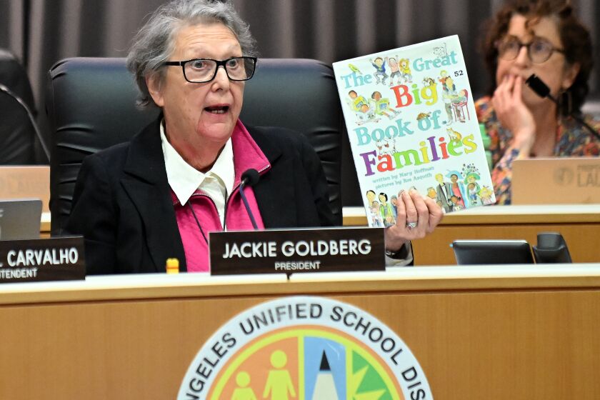 Los Angeles, California June 6, 2023-LAUSD school board member Jackie Goldberg holds up a book 'The Great Big Book of Famialies' during a board meeting in Los Angeles Tuesday. (Wally Skalij/Los Angeles Times)
