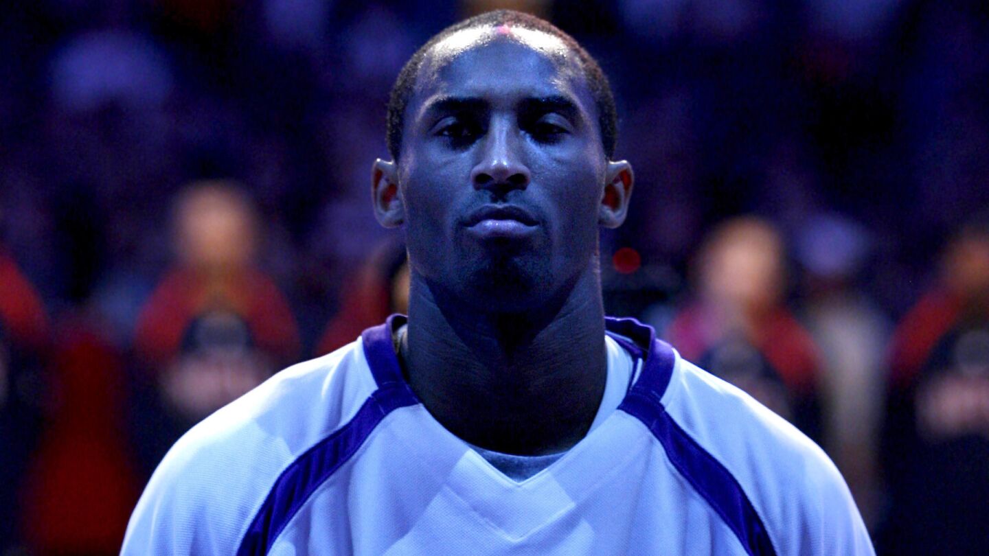 Lakers star Kobe Bryant listens to the national anthem before a game against the New Jersey Nets on Nov. 26, 2006.