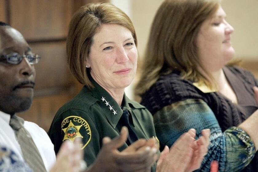 Orange County Sheriff Sandra Hutchens, center, involved in her first election campaign for her office, attends a Rotary Club meeting in Anaheim Hills.
