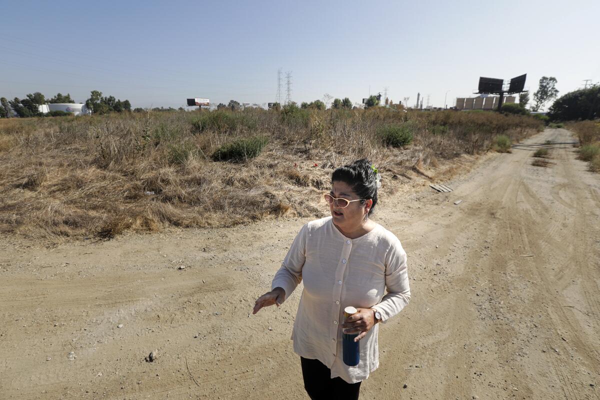Wendy Katagi, from Stillwater Sciences, at the future site of the planned project along the Los Angeles River in South Gate.