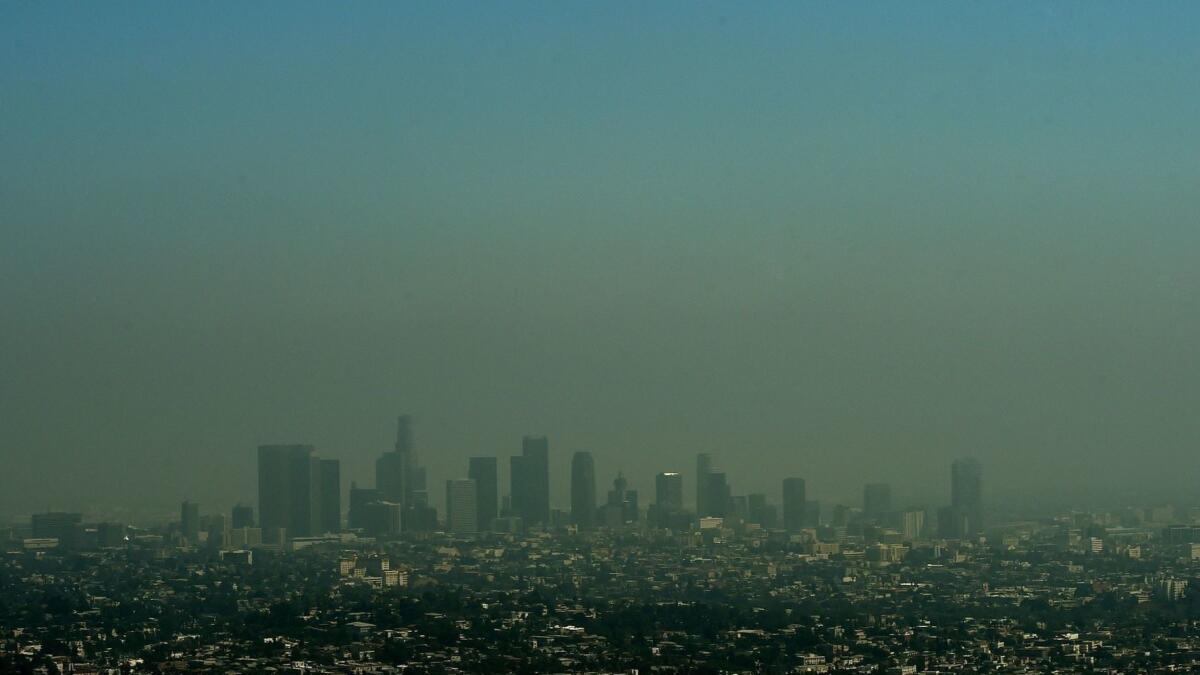 Heavy smog shrouds the Los Angeles skyline in 2015.
