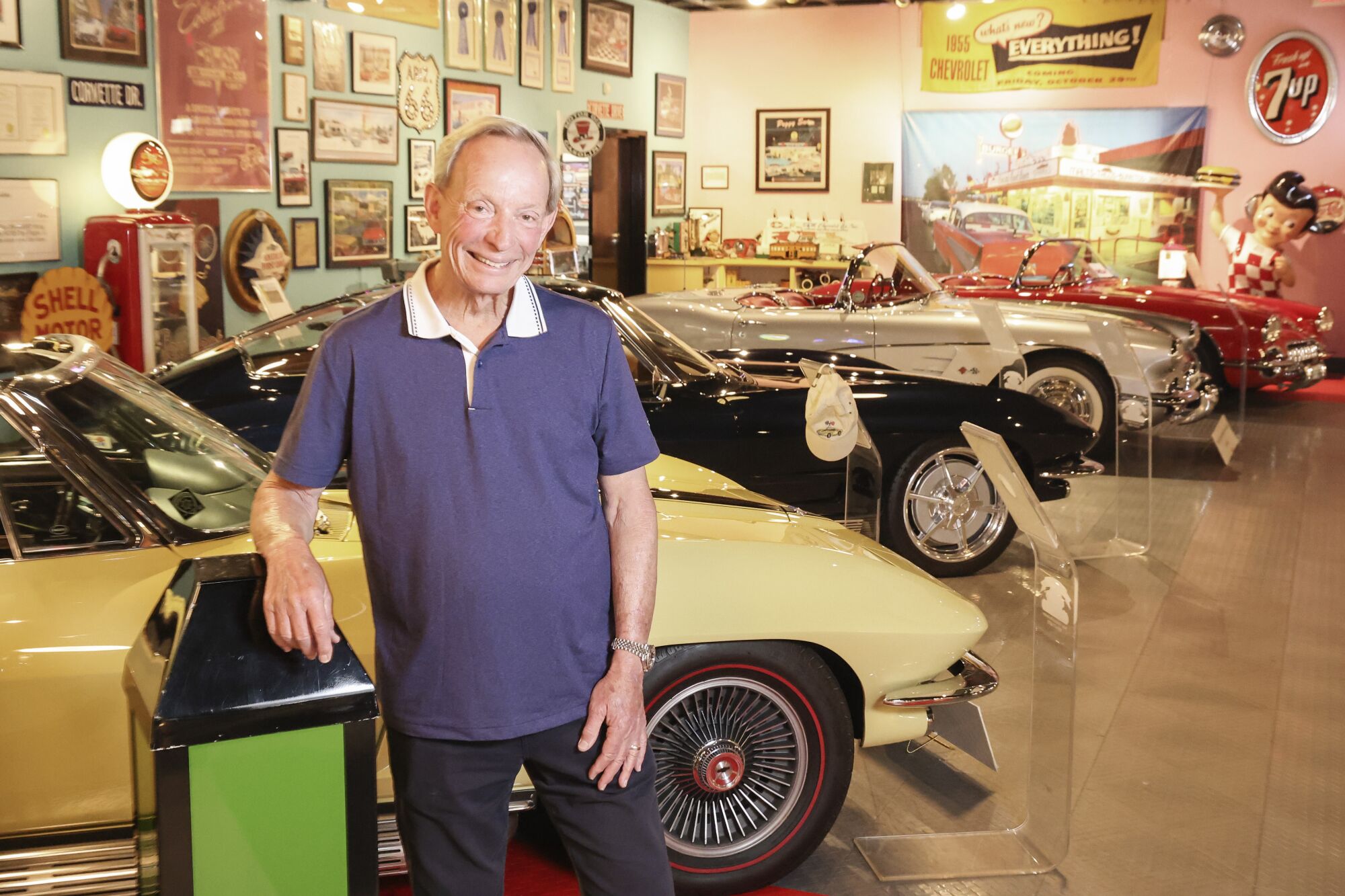 Car collector Chuck Spielman's poses for photos in his private museum called Only Yesterday in Sorrento Valley.