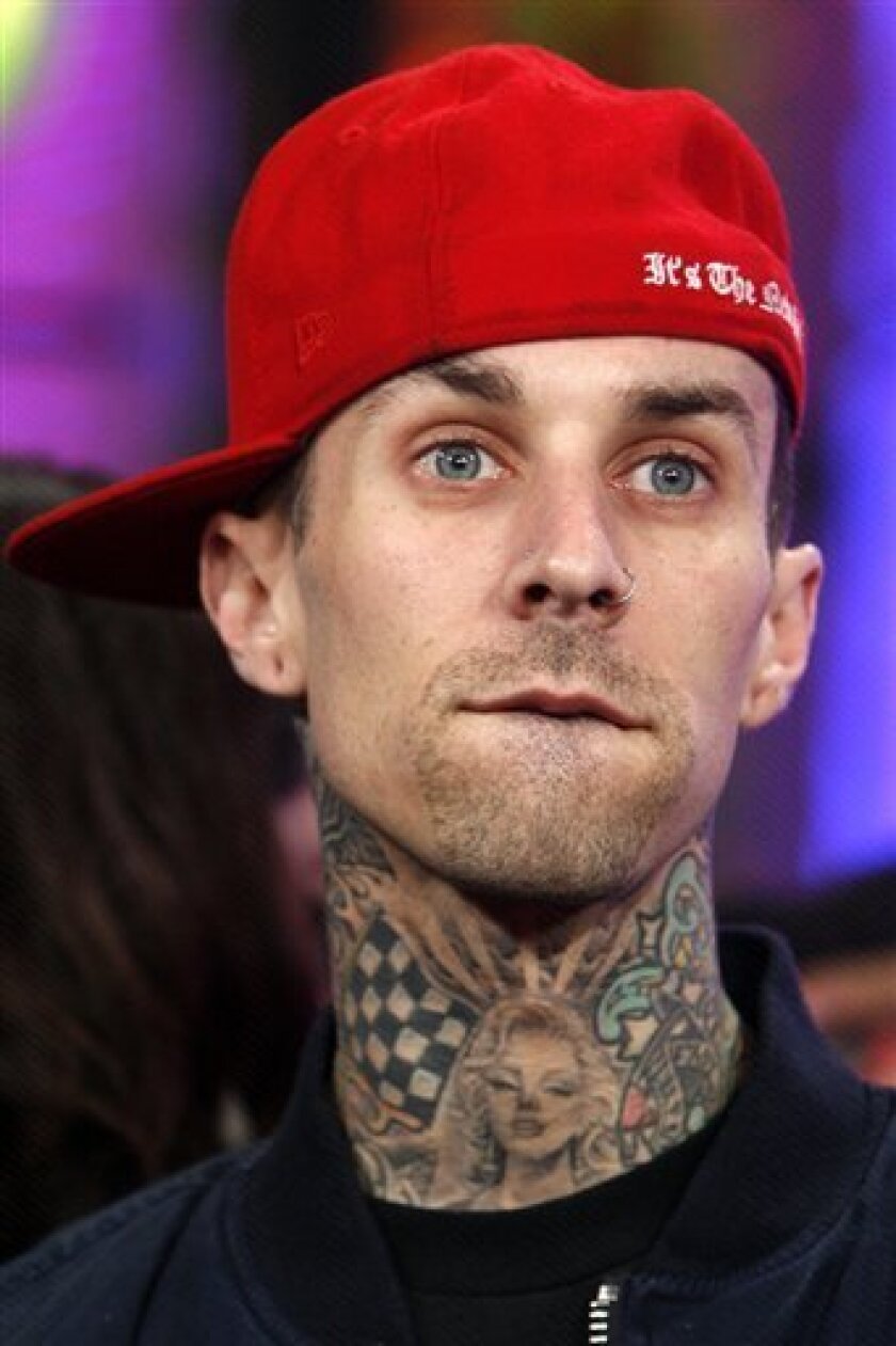 This Nov. 17, 2006 file photo shows Travis Barker as he appears onstage during MTV's "Total Request Live" at the MTV Times Square Studios, in New York. Travis Barker has sued over a plane crash that left him injured and killed two of his friends. (AP Photo/Jason DeCrow, file)