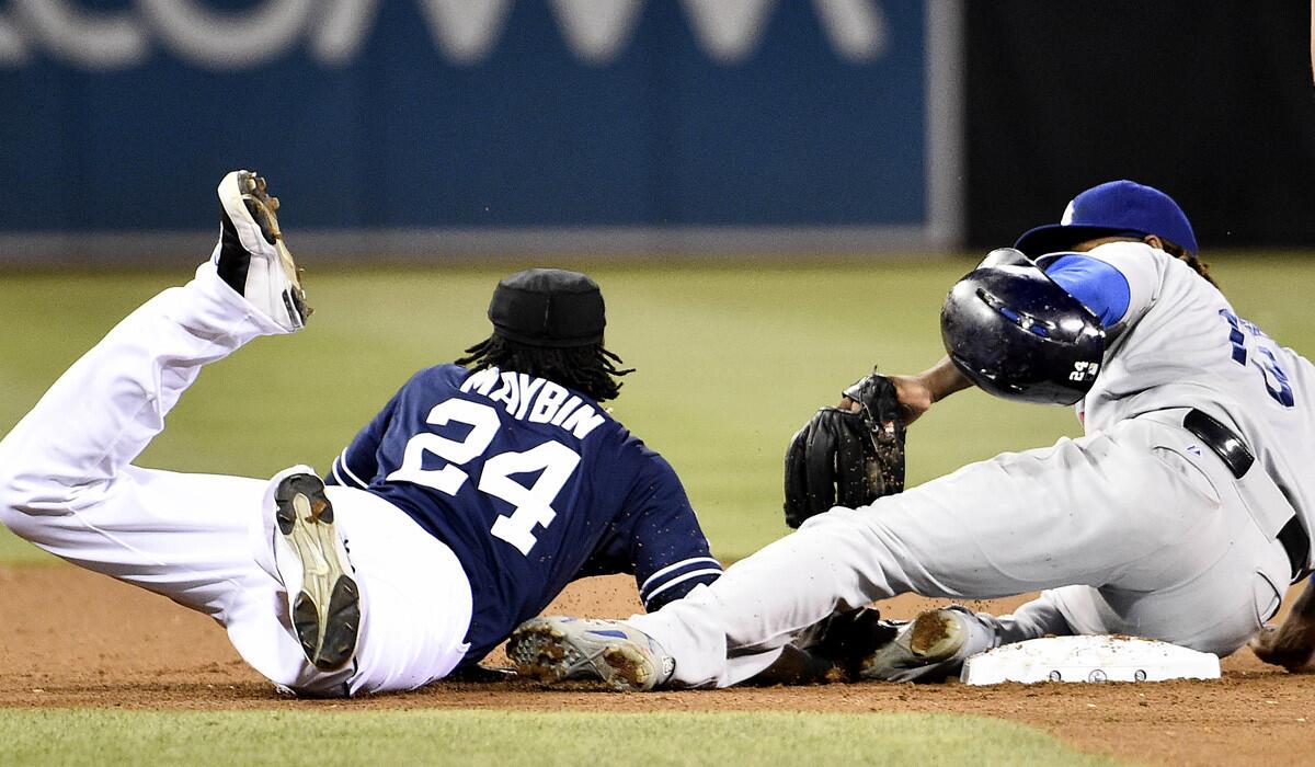 Dodgers shortstop Hanley Ramirez tags out Padres pinch-runner Cameron Maybin, who was picked off at second base.