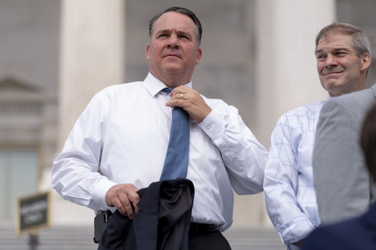 FILE - Rep. Alexander Mooney, R-W.Va., left, and Rep. Jim Jordan, R-Ohio, right, appear at a news conference on the steps of the Capitol in Washington, July 29, 2021. The May 10 primary contest in West Virginia's 2nd Congressional District between Republican colleagues Rep. Alex Mooney and Rep. David McKinley is a test of former Donald Trump’s clout in the state. McKinley voted to pass the infrastructure bill and was condemned by both Trump and Mooney for doing so. (AP Photo/Andrew Harnik, File)