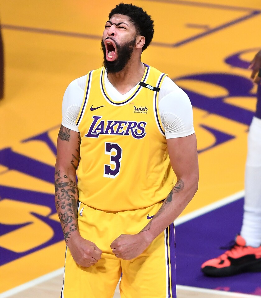 Lakers forward Anthony Davis celebrates his basket after being fouled by a Suns player during Game 3.