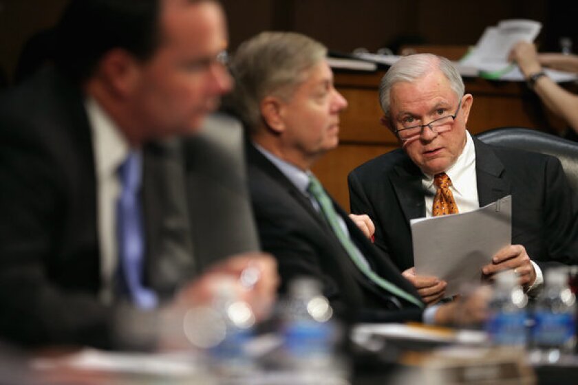 Senate Judiciary Committee member Sen. Jeff Sessions (R-Ala.), right, listens to debate during a markup session for the immigration reform legislation in the Hart Senate Office Building on Capitol Hill.
