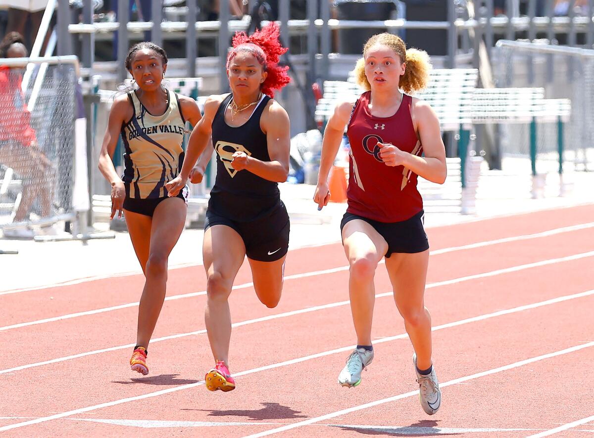 Gardena Serra High's Brazil Neal, right, leads the field in the 200-meter dash at the Masters Meet on May 20 in Moorpark.